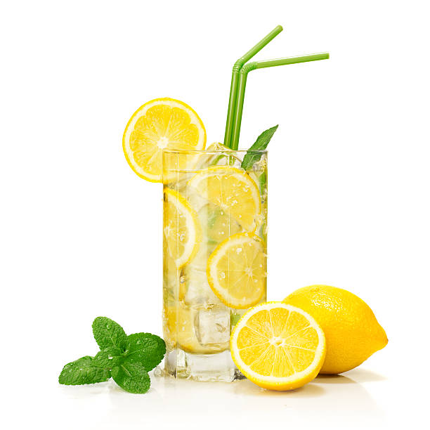 “glass of cold lemonade served and garnished, isolated on white background.”